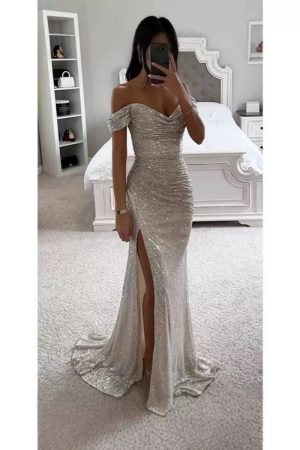 Sleek, high-slit, glittery sequined dress.